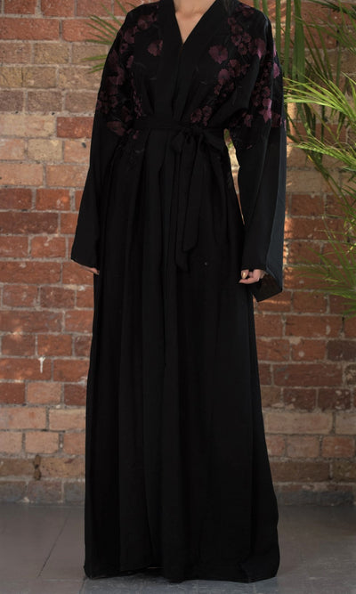 Aaliya Collections A classic black abaya with contrasting burgundy floral embroidery