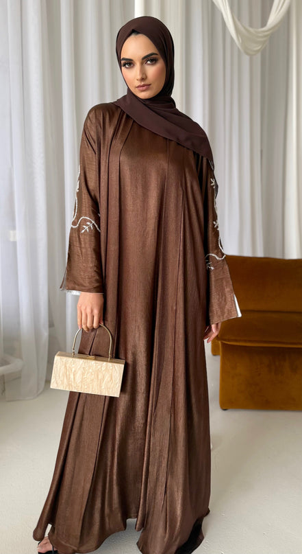 brown abaya set with silver embellishments across the sleeves