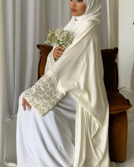 white abaya with stone embellished sleeves