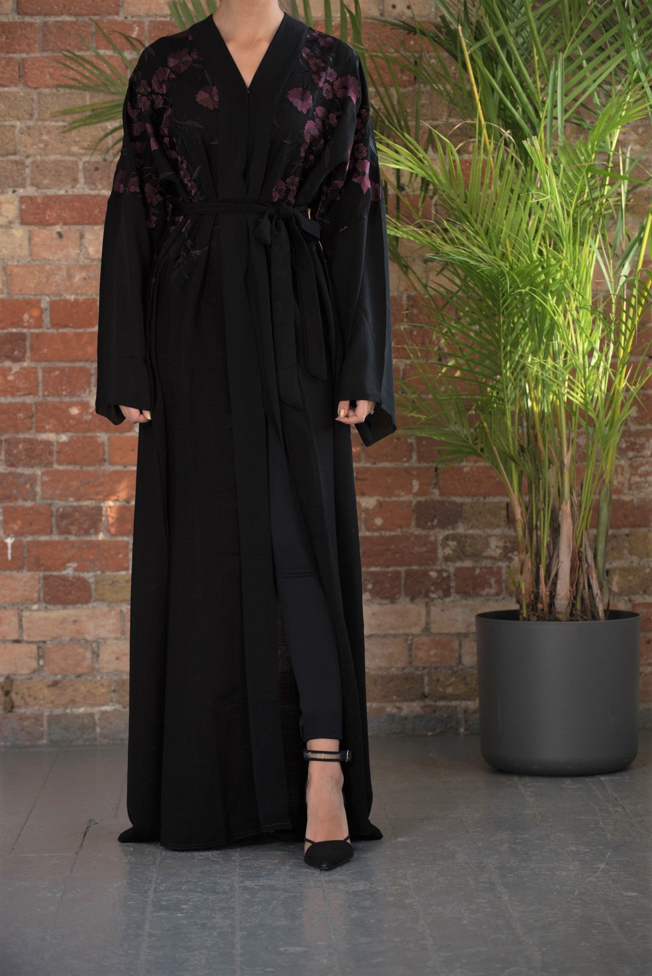Aaliya Collections A classic black abaya with contrasting burgundy floral embroidery