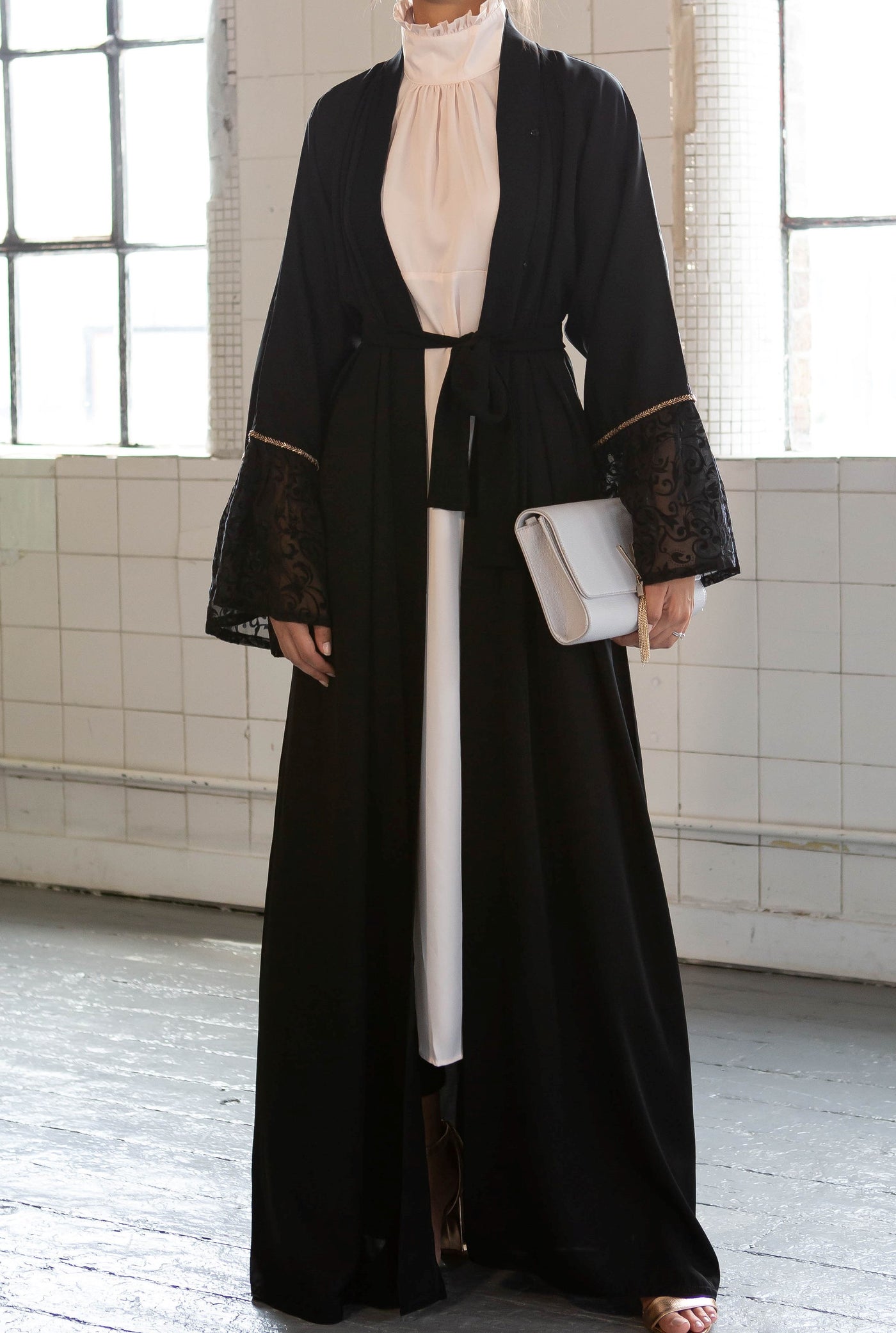 Aaliya Collections Black Bell Sleeve Abaya with contrasting lace sleeves bordered with striking gold sequin trimming