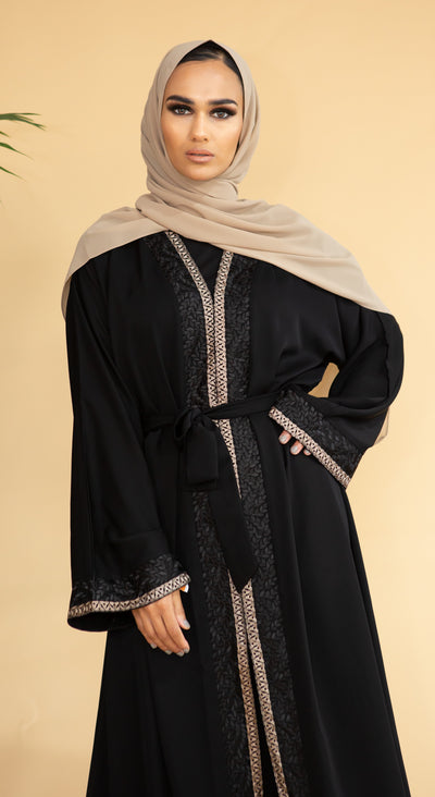 Aaliya Collections Hidaya Abaya A beautiful black abaya with a gorgeous contrast of gold and black leaf bordering