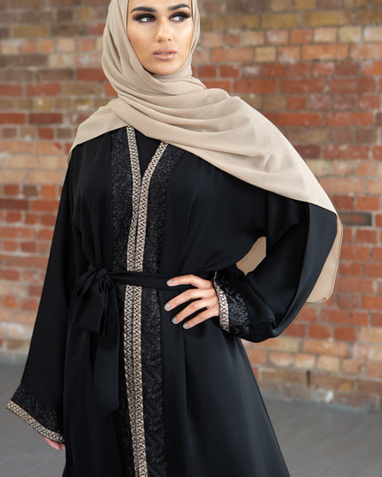 Aaliya Collections Hidaya Abaya A beautiful black abaya with a gorgeous contrast of gold and black leaf bordering