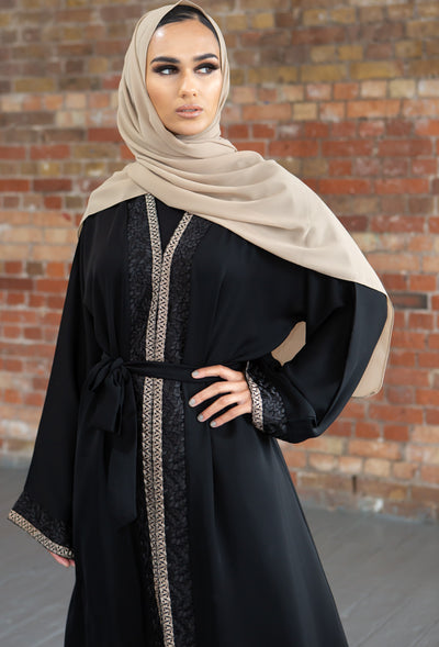 Aaliya Collections Hidaya Abaya A beautiful black abaya with a gorgeous contrast of gold and black leaf bordering